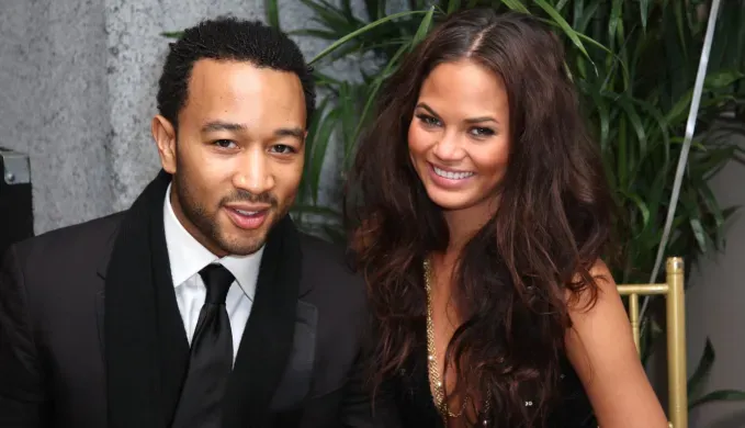 chrissy teigen and john legend smiling' fetchpriority='auto' title='A Definitive Timeline of Chrissy Teigen’s Rise from ‘Deal or No Deal’ Briefcase Model to Queen of Twitter