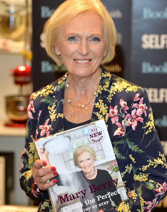 mary berry holding her new cookbook' fetchpriority='auto' title='7 British Chefs (Who Aren’t Gordon Ramsay or Jamie Oliver) Who Should Totally Be on Your Radar