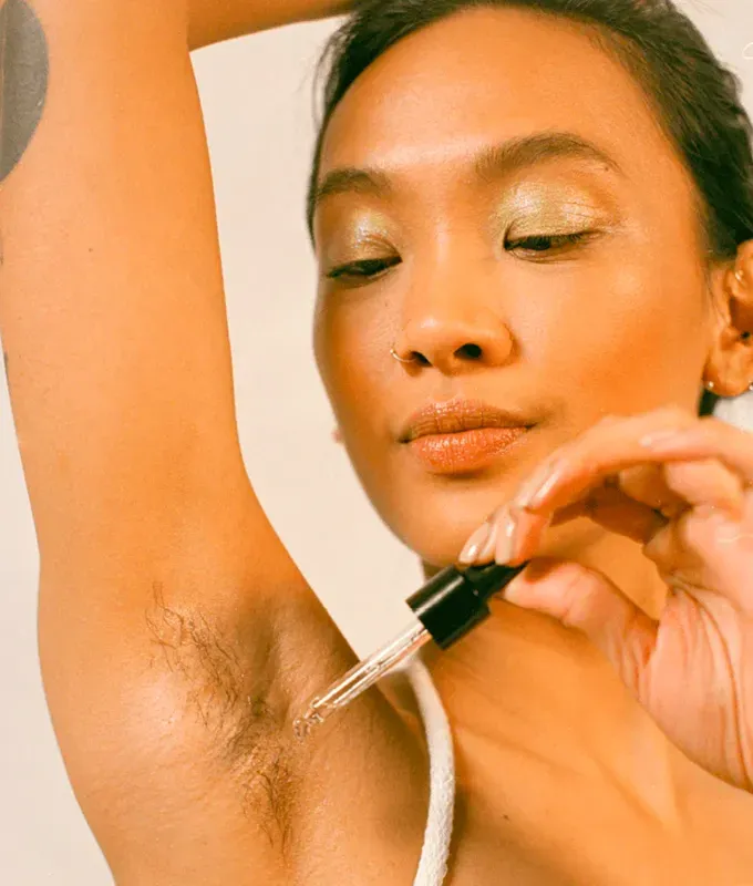 Honest and Candid Review of Fur Oil: image of woman applying the fur oil to her armpit' title='I Used this Ingrown Bikini Bump Eraser All Over My Body. Here’s What Happened