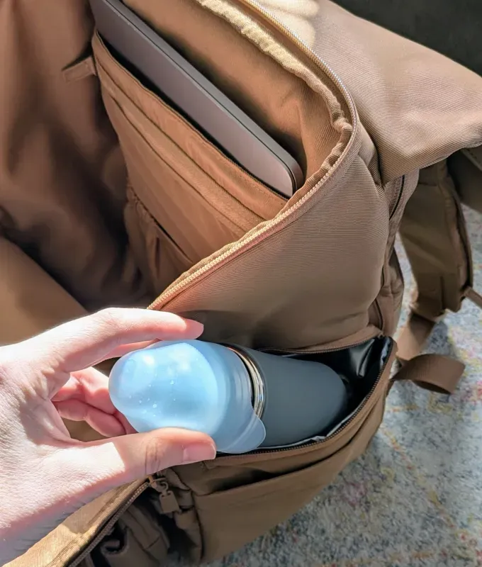 side pockets on beis ultimate diaper backpack' title='If You’re Flying with a Baby This Year You Need to Read This Béis Ultimate Diaper Backpack Review