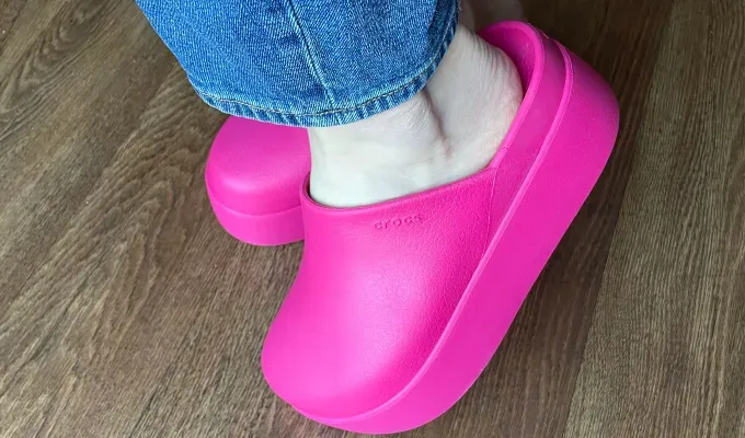 Crocs Dylan Platform Clogs Review: Pink platform clogs on editor Stephanie Maida’s feet' title='These Platform Crocs Are Cute Comfy & Make Me Feel Like a Spice Girl