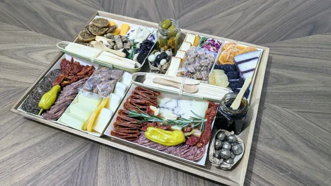 the boarderie charcuterie board all set up and ready to serve to guests' title='Boarderie’s Charcuterie Boards Have Been a Hit with Oprah and ‘Shark Tank’ But Are They Worth $129+?