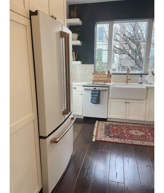 GE-Cafe-Refrigerator: A photo of a GE Cafe Refrigerator in a nook in an all white kitchen. Side view.' title='My CAFÈ Refrigerator Review: Stunning Looks & Smart Capabilities