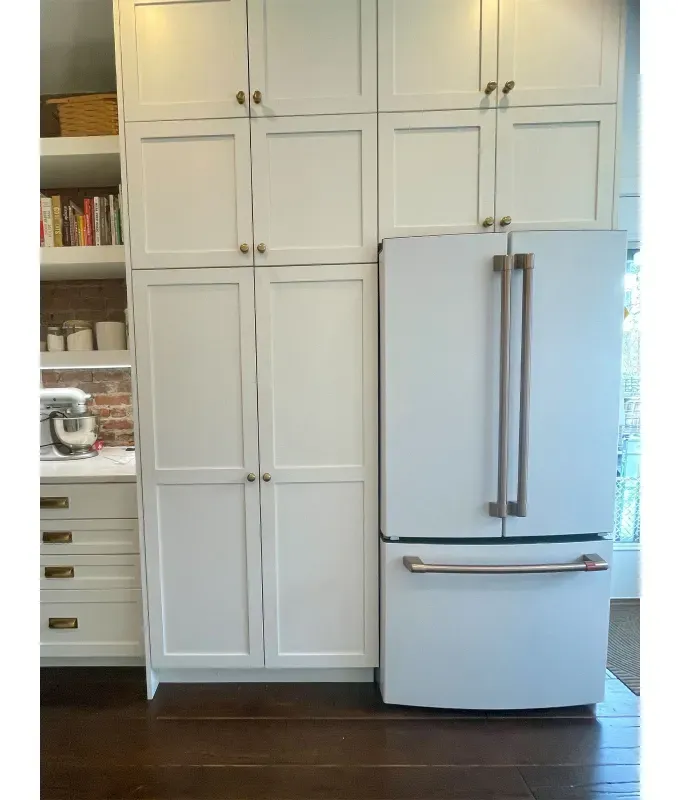 GE-Cafe-Refrigerator: A photo of a GE Cafe Refrigerator in a nook in an all white kitchen.' title='My CAFÈ Refrigerator Review: Stunning Looks & Smart Capabilities