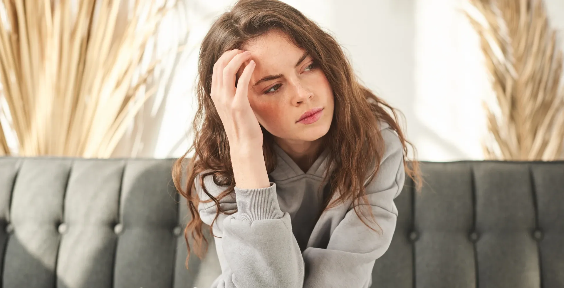 Intimidating woman looking annoyed on the couch' title='subtle traits of a cold-hearted person intimidating' typeof='foaf:Image' decoding='async