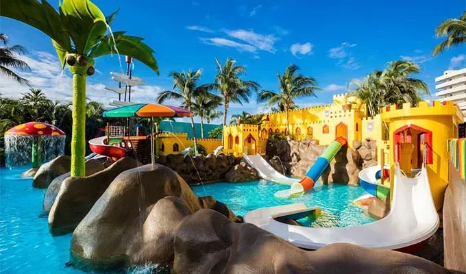 affordable-all-inclusive-resorts Family pool at Crown Cancun resort' title='17 Amazing Affordable All-Inclusive Resorts Vetted by a Travel Editor