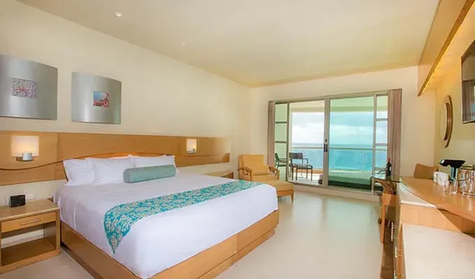 affordable-all-inclusive-resorts-beach-palace-cancun: Beach palace hotel room' title='17 Amazing Affordable All-Inclusive Resorts Vetted by a Travel Editor
