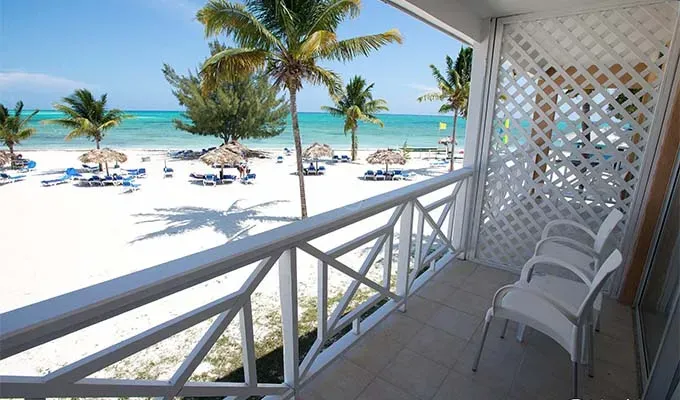 Affordable all-inclusive resorts: Bahamas porch overlooking ocean' title='17 Amazing Affordable All-Inclusive Resorts Vetted by a Travel Editor