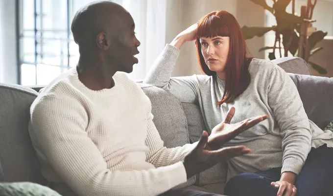 Leo and pisces partners disagreeing on couch' fetchpriority='auto' title='Leo Compatibility: The Best and Worst Zodiac Partner for Leos Ranked