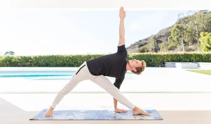 standing yoga poses extended triangle triangle pose' fetchpriority='auto' title='30 Standing Yoga Poses Every Yogi Needs to Know