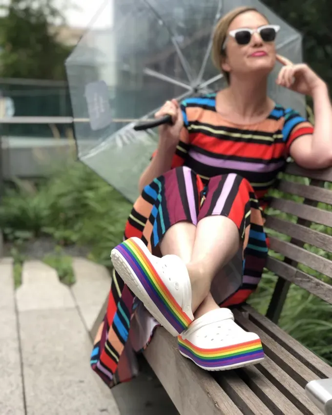 Original photo of editor Dara Katz in rainbow platform Crocs' fetchpriority='auto' title='I’m Obsessed With Crocs So I Asked Podiatrists What They Really Think About Them
